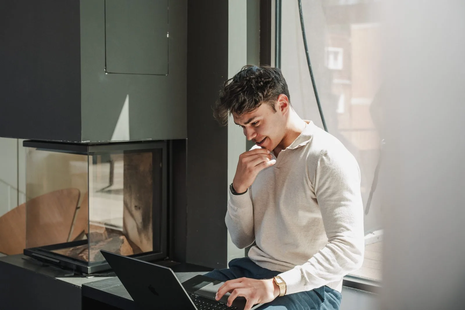 A Uplane engineer working through a problem at the window