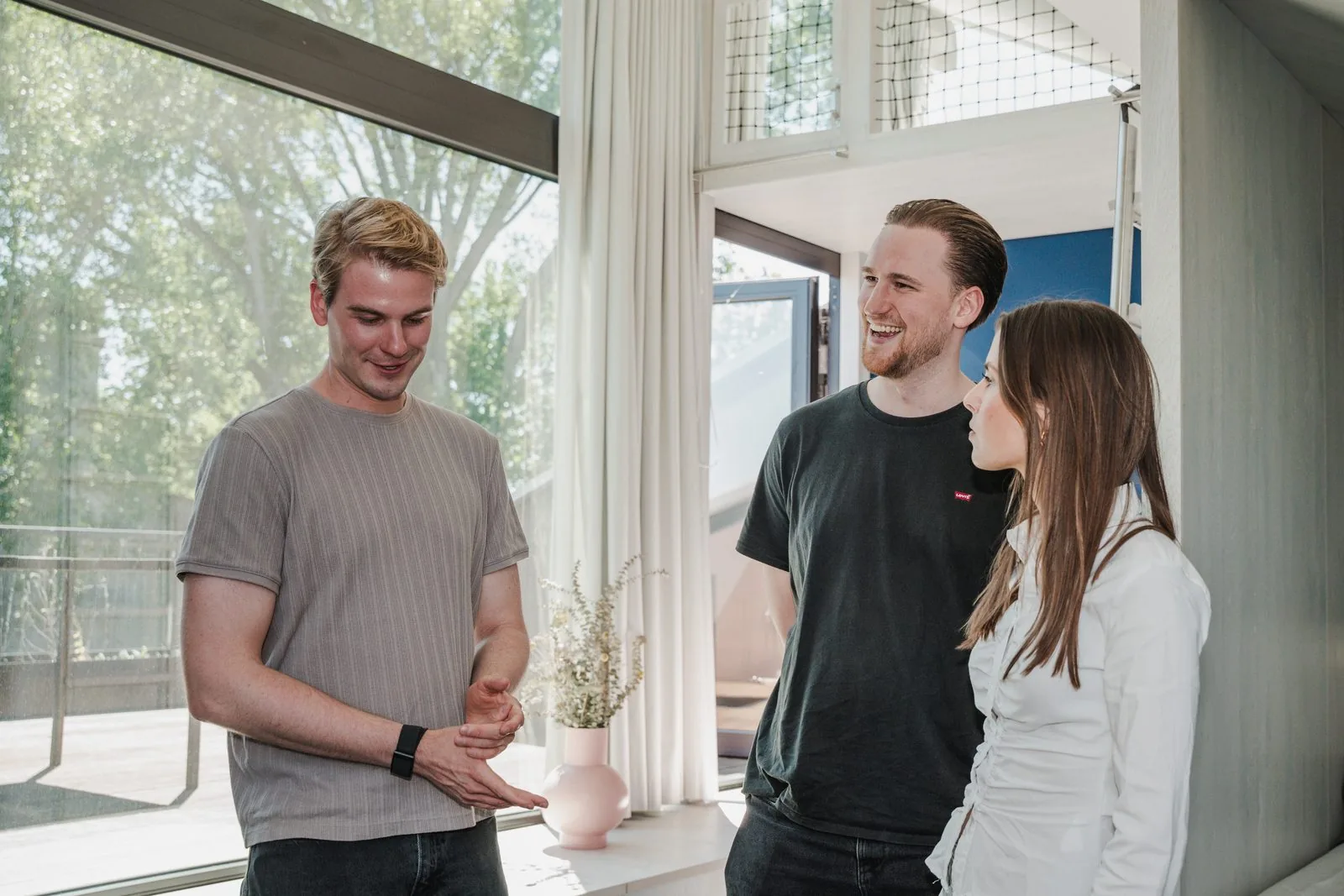 Three Uplane colleagues talking through an idea